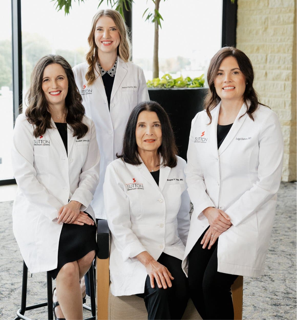 Group photo of all the Sutton Doctors featuring Margaret Sutton, Elizabeth Sutton, Leigh Sutton, and Jessica Harms