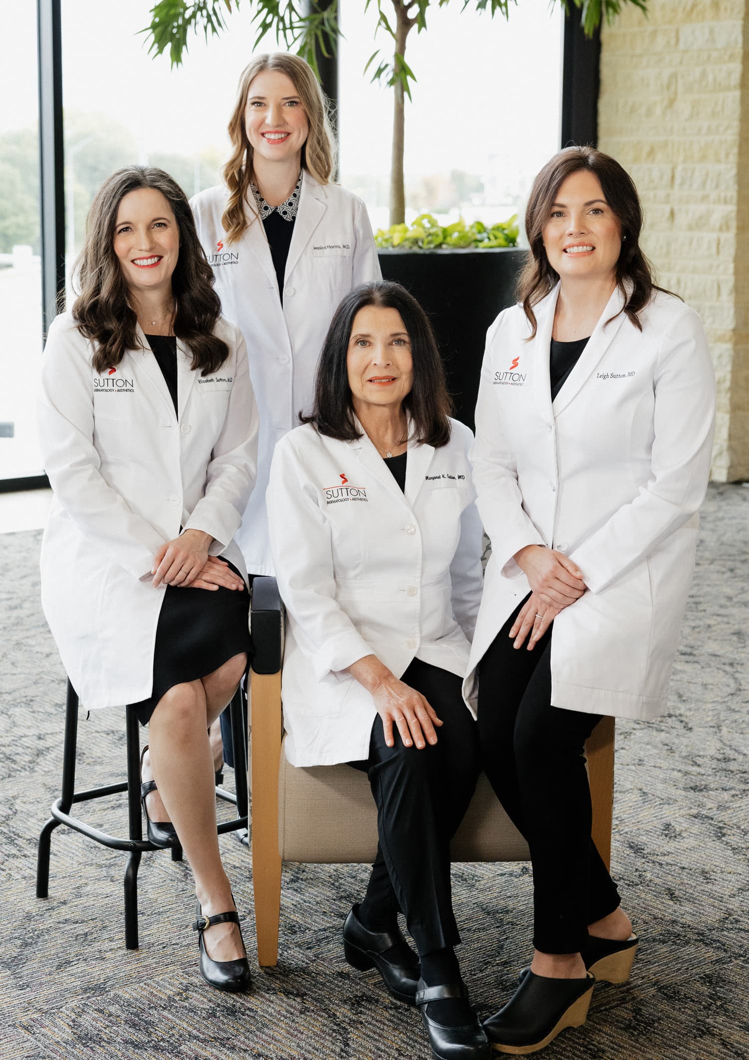 Group photo of all the Sutton Doctors featuring Margaret Sutton, Elizabeth Sutton, Leigh Sutton, and Jessica Harms