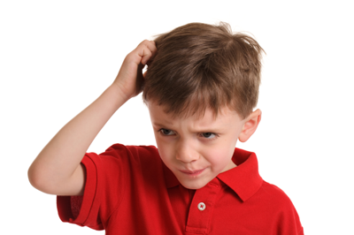 Young boy scratching his head wearing a red polo