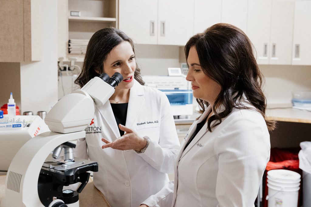 Dr. Liz Sutton & Dr. Leigh Sutton discussing tissue samples