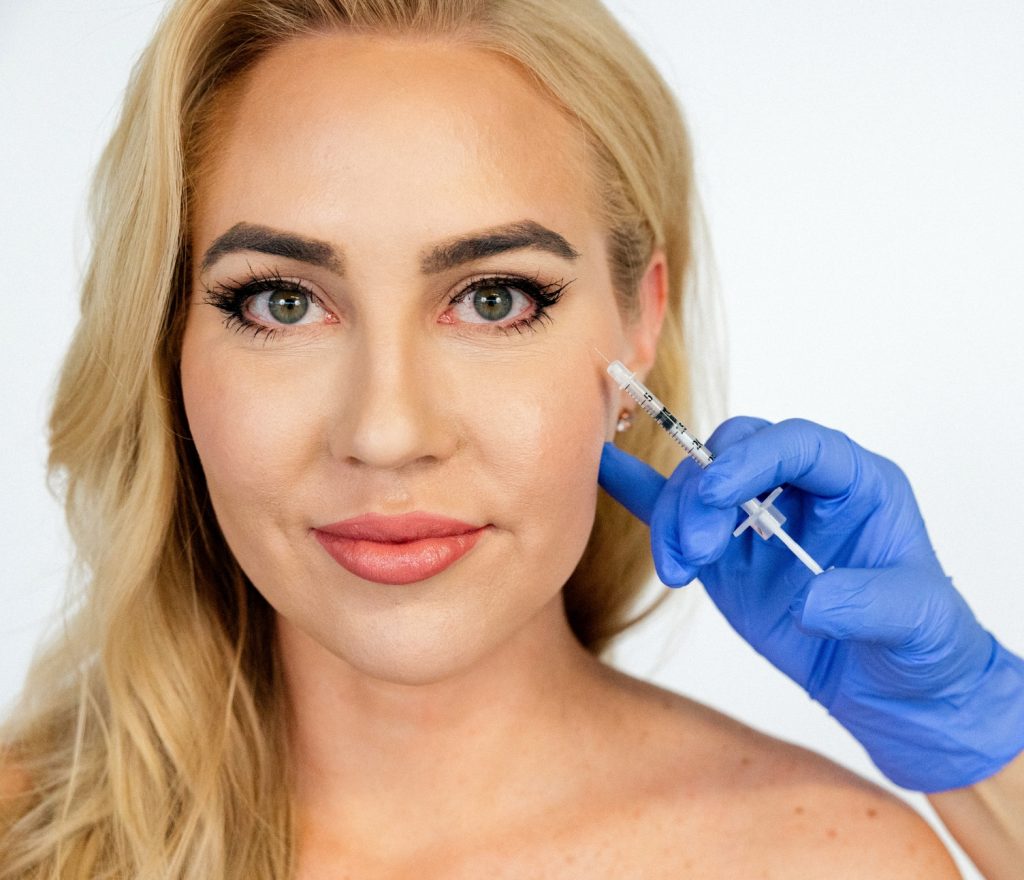 Patient receiving Botox treatment on left side of her face