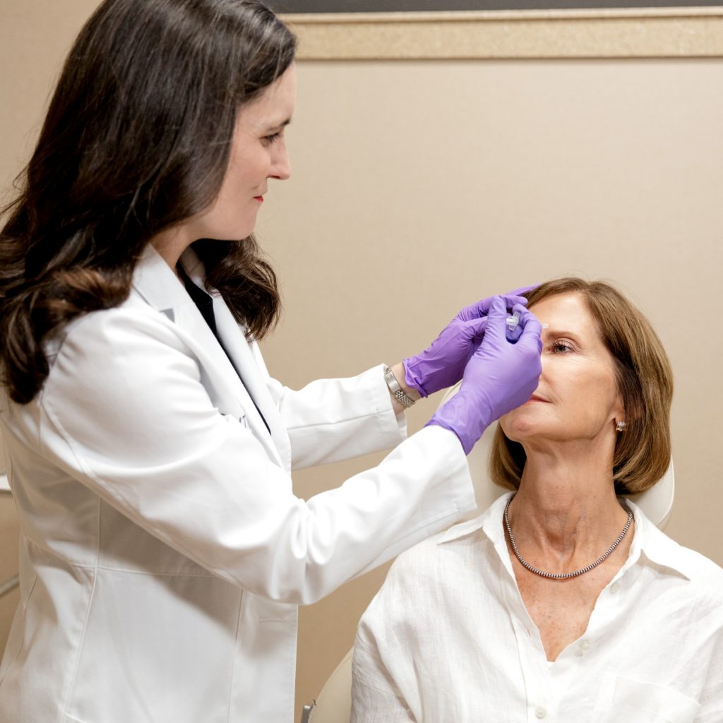 Provider applying Botox treatment to patient