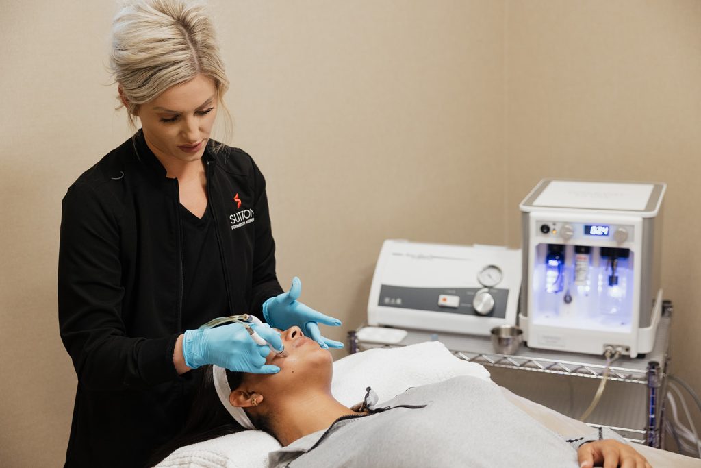 Provider Meghan Richards applying DiamondGlow Facial treatment to patient