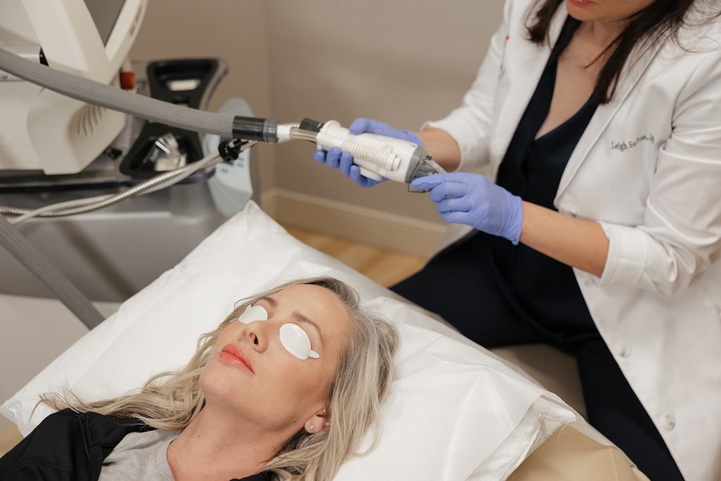 Patient lying down with eye covers on awaiting laser treatment from Dr. Leigh Sutton