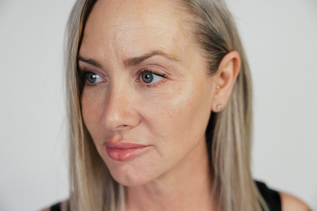 Woman with gray blue eyes staring off to the right