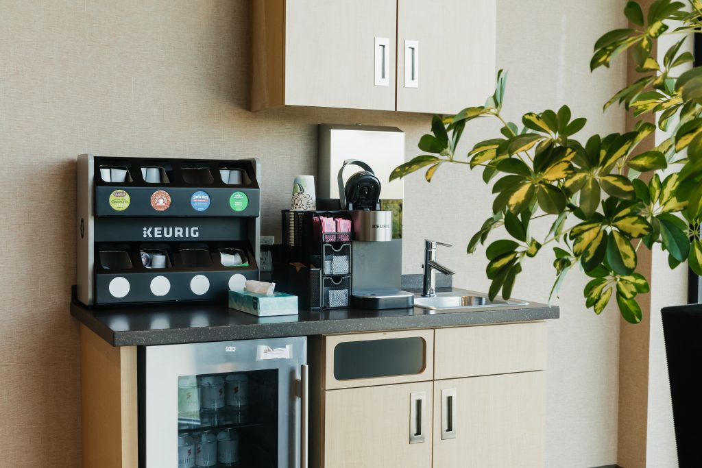 Interior building image showing coffee station at South Clinic Sutton Dermatology + Aesthetics