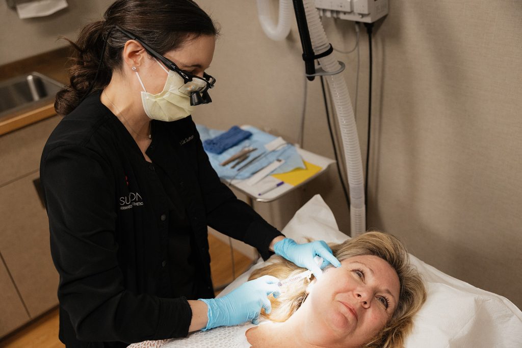 Dr. Elizabeth Sutton operating on a patient